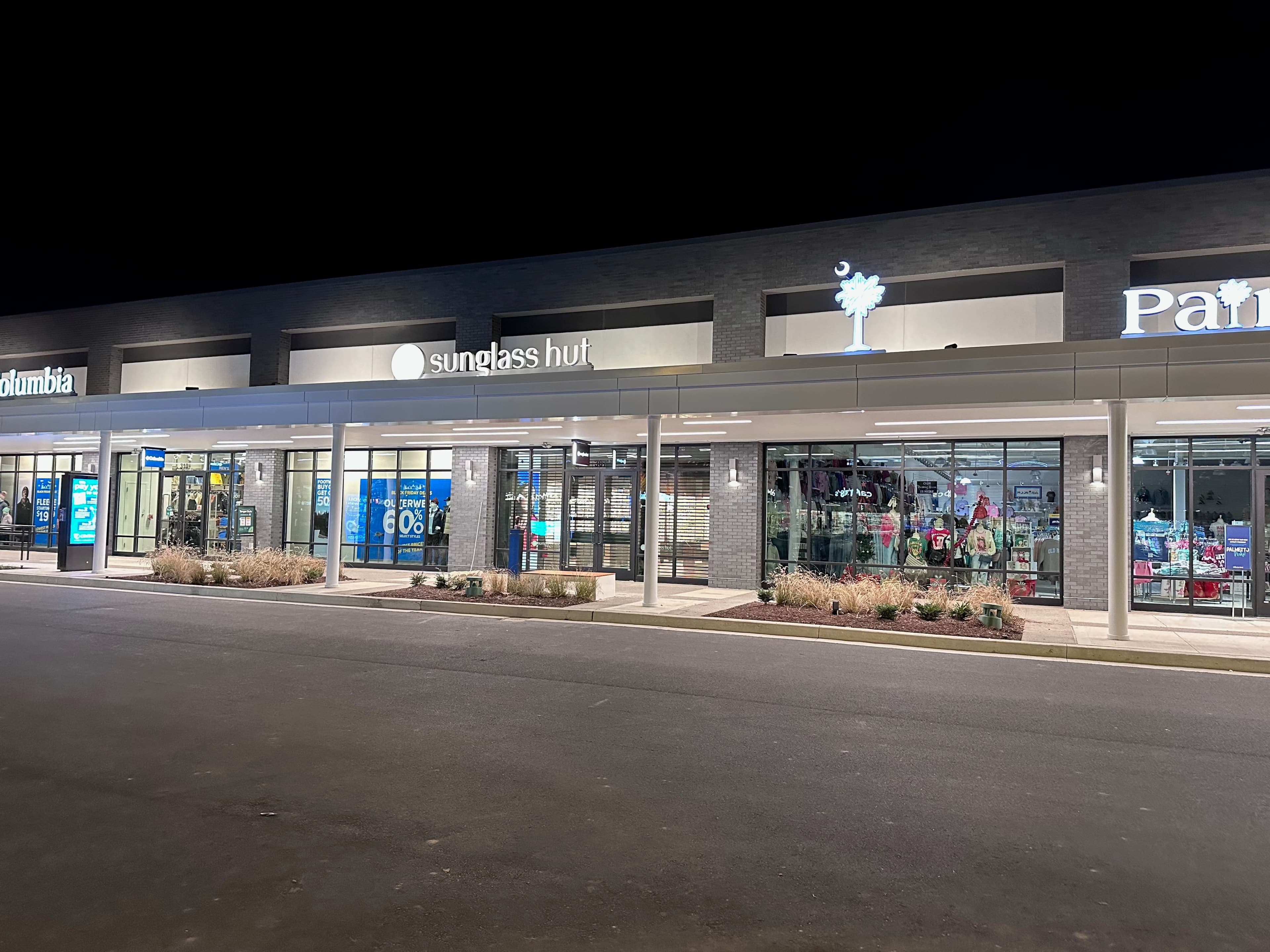 Image showcasing front of Sunglass Hut store at Tanger Outlet.